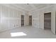 Spacious bedroom featuring a neutral color palette, with walk-in closets and ensuite bathroom access at 2305 Turners Aly, Raleigh, NC 27607