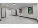 Bonus room features windows, modern trim, and neutral colored walls and trim at 2305 Turners Aly, Raleigh, NC 27607