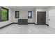 Bonus room featuring windows, modern trim, built-in cabinets and neutral colored walls at 2305 Turners Aly, Raleigh, NC 27607