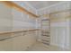Walk-in closet showcasing built-in shelving and custom design at 2305 Turners Aly, Raleigh, NC 27607