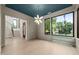 Elegant dining room with hardwood floors, a statement chandelier, and large windows, perfect for entertaining at 2305 Turners Aly, Raleigh, NC 27607