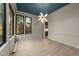 Elegant dining room with hardwood floors, a statement chandelier, and large windows, perfect for entertaining at 2305 Turners Aly, Raleigh, NC 27607