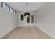 Light-filled dining room with modern pendant lighting and natural wood floors at 2305 Turners Aly, Raleigh, NC 27607