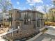 Contemporary home featuring brick and gray siding with large windows and modern design elements at 2305 Turners Aly, Raleigh, NC 27607