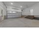 Spacious two-car garage featuring ample space and a side door for easy access at 2305 Turners Aly, Raleigh, NC 27607