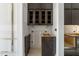 A kitchen area with dark wood cabinetry featuring modern design and storage solutions at 2305 Turners Aly, Raleigh, NC 27607