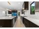 Bright kitchen featuring stainless steel appliances, dark wood cabinets, and white countertops at 2305 Turners Aly, Raleigh, NC 27607