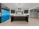 Spacious kitchen with a large island, modern appliances, and sleek cabinetry, designed for culinary enthusiasts at 2305 Turners Aly, Raleigh, NC 27607