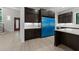 Contemporary kitchen featuring dark cabinetry, a center island, and modern fixtures, creating a stylish cooking space at 2305 Turners Aly, Raleigh, NC 27607
