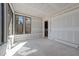 Spacious room featuring large windows, drywall, and natural light at 2305 Turners Aly, Raleigh, NC 27607