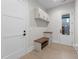 Functional mudroom with built-in bench, storage cabinets, and access to the outdoors at 2305 Turners Aly, Raleigh, NC 27607