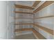 Pantry featuring wooden shelves with a corner design, offering ample storage space at 2305 Turners Aly, Raleigh, NC 27607