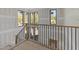 Modern staircase with black railings, natural wood treads and ample natural light at 2305 Turners Aly, Raleigh, NC 27607