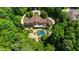 Majestic estate with expansive pool, lush landscaping, and a grand circular driveway at 2421 Acanthus Dr, Wake Forest, NC 27587
