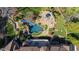 Breathtaking aerial view of the luxurious backyard featuring a large pool, stone patio, and lush landscaping at 2421 Acanthus Dr, Wake Forest, NC 27587