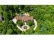 Magnificent residence features a large backyard pool and a circular driveway with water feature at 2421 Acanthus Dr, Wake Forest, NC 27587