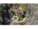 Stunning aerial view of a grand home with a circular driveway, manicured landscaping, and a sprawling layout at 2421 Acanthus Dr, Wake Forest, NC 27587