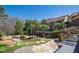 Expansive backyard featuring lush landscaping, stone pathways, and a private pool for outdoor relaxation at 2421 Acanthus Dr, Wake Forest, NC 27587