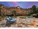 Lush backyard with a sparkling pool, inviting lounge chairs, and a beautifully landscaped garden area at 2421 Acanthus Dr, Wake Forest, NC 27587
