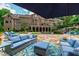 Stunning backyard featuring a spacious patio, manicured lawn, inviting pool, and charming outdoor furniture at 2421 Acanthus Dr, Wake Forest, NC 27587