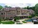 Sprawling backyard features a patio, pool, and lush landscaping perfect for outdoor entertaining at 2421 Acanthus Dr, Wake Forest, NC 27587
