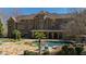 Luxurious backyard featuring a pool, patio, mature landscaping, and covered outdoor space for entertaining at 2421 Acanthus Dr, Wake Forest, NC 27587