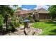 Expansive brick home with lush landscaping, stone details, and a serene backyard oasis at 2421 Acanthus Dr, Wake Forest, NC 27587