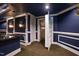 Finished basement showcasing custom bar, starry ceiling, hidden storage space with a built-in vault, and designer paint at 2421 Acanthus Dr, Wake Forest, NC 27587