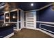 Finished basement with custom wall trim, carpeting, bar area, and unique shelving, with blue walls, and starry ceiling at 2421 Acanthus Dr, Wake Forest, NC 27587
