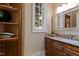 Powder room with custom vanity, granite countertops, and natural light at 2421 Acanthus Dr, Wake Forest, NC 27587