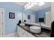 Bright bathroom featuring a double vanity with marble countertops and vessel sinks at 2421 Acanthus Dr, Wake Forest, NC 27587