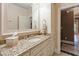Bathroom featuring granite countertops, decorative cabinets, and a large mirror at 2421 Acanthus Dr, Wake Forest, NC 27587
