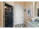 Stylish bathroom with a glass-enclosed shower and vanity with coastal decor at 2421 Acanthus Dr, Wake Forest, NC 27587