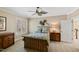 Comfortable bedroom featuring a decorative ceiling fan and a large window with shuttered blinds at 2421 Acanthus Dr, Wake Forest, NC 27587