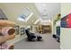 Bonus room with seating area, bunk beds, skylights and carpet at 2421 Acanthus Dr, Wake Forest, NC 27587