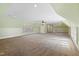Spacious carpeted bonus room with an airy feel, large windows, and recessed lighting at 2421 Acanthus Dr, Wake Forest, NC 27587