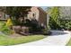 Landscaped driveway leading to house with stone and brick accents at 2421 Acanthus Dr, Wake Forest, NC 27587