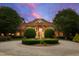 Stately brick home featuring a circular driveway and fountain at 2421 Acanthus Dr, Wake Forest, NC 27587