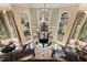 Stunning foyer with dual staircases, large windows, and a chandelier creates a grand entrance at 2421 Acanthus Dr, Wake Forest, NC 27587