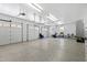 Spacious three-car garage with epoxy floor, ample storage, and natural light at 2421 Acanthus Dr, Wake Forest, NC 27587