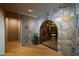 Hallway with stone archway and wine cellar at 2421 Acanthus Dr, Wake Forest, NC 27587