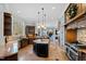 Spacious kitchen with center island, stainless steel appliances, and granite countertops at 2421 Acanthus Dr, Wake Forest, NC 27587