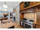 Kitchen with stainless steel range, custom cabinetry, and granite countertops at 2421 Acanthus Dr, Wake Forest, NC 27587