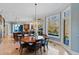 Eat-in kitchen featuring a dining table, large windows, and bar-style seating provides a relaxed, sunlit space at 2421 Acanthus Dr, Wake Forest, NC 27587