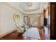 Bright living room featuring hardwood floors, fireplace, and a window view at 2421 Acanthus Dr, Wake Forest, NC 27587