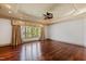 A spacious living room with hardwood floors and a large window at 2421 Acanthus Dr, Wake Forest, NC 27587