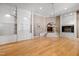 Bright living room features hardwood floors, built-in shelving, and a fireplace at 2421 Acanthus Dr, Wake Forest, NC 27587