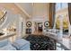 Spacious living room featuring a decorative rug, columns, and elegant furnishings at 2421 Acanthus Dr, Wake Forest, NC 27587