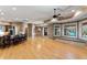 Spacious living room with hardwood floors, wet bar, and window seat overlooking the pool at 2421 Acanthus Dr, Wake Forest, NC 27587
