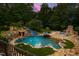 Aerial view of the backyard pool with a waterslide feature and fireplace at 2421 Acanthus Dr, Wake Forest, NC 27587